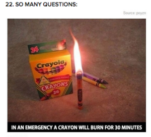 a box of crayons and a lit crayon