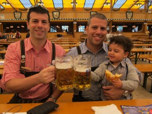 a group of men holding beer glasses