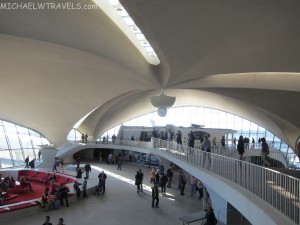 a group of people in TWA Flight Center