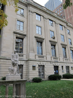 a statue in front of a building
