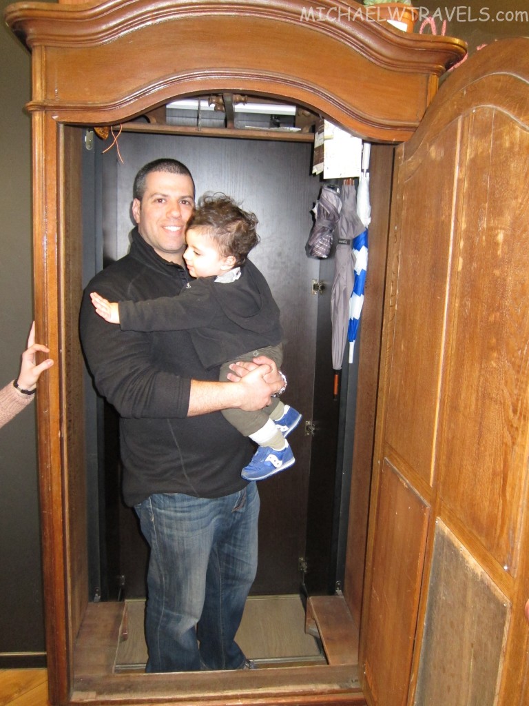 a man holding a child in a doorway