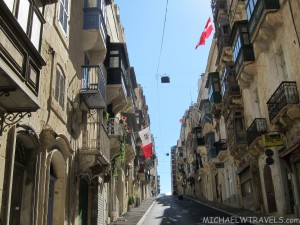 a street with buildings and flags