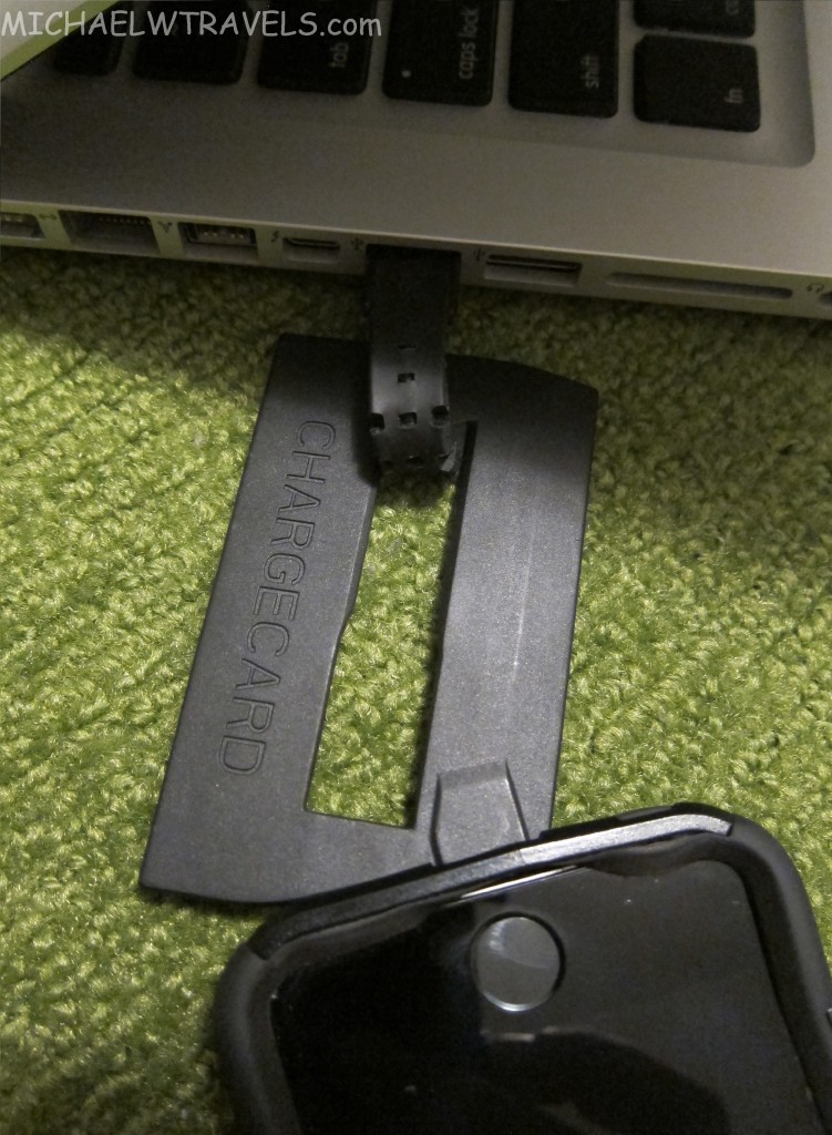 a black usb cable connected to a laptop