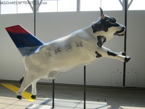 a cow statue in a room
