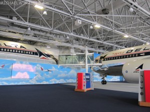 a large hangar with airplanes