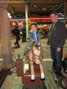 a child riding a rocking horse