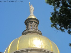 a statue on top of a dome