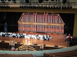 a stage with a stage and black and white balloons
