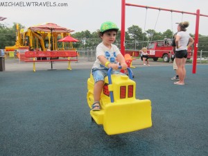 a child riding a toy tractor