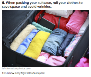 a suitcase with folded clothes