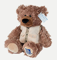 a stuffed bear with a tag