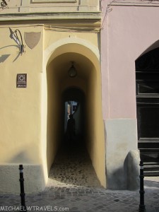a building with a light in the doorway