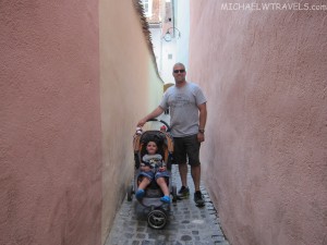 a man pushing a stroller with a child
