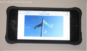 a phone with a picture of a street sign
