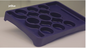a purple muffin tray with holes