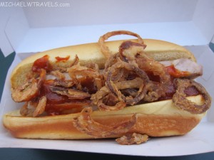 a hot dog with onions on it
