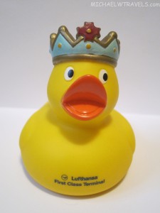 a yellow rubber duck with a crown