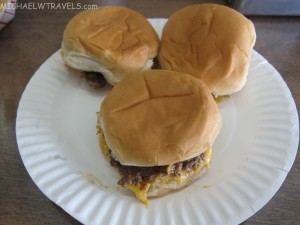 a plate of hamburgers on a table