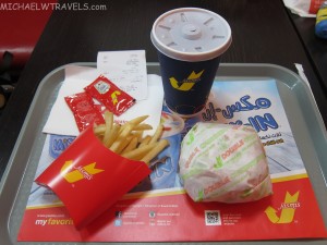 a tray with french fries and a drink