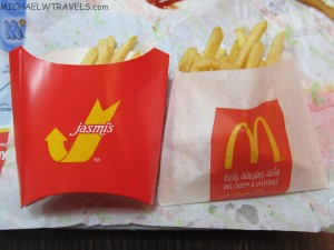 a red and white container with french fries