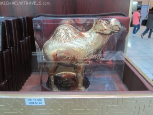 a gold camel in a plastic case