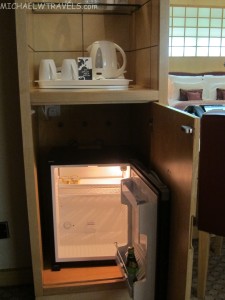 a small mini fridge in a hotel room