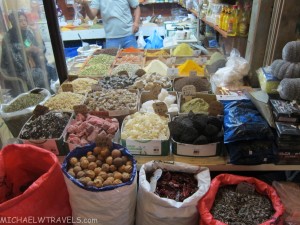 a variety of spices and food in a market