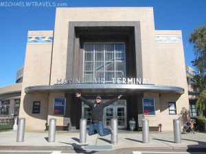a man jumping in front of a building