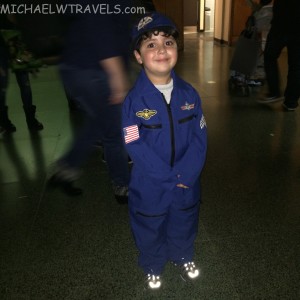 a boy in a blue uniform