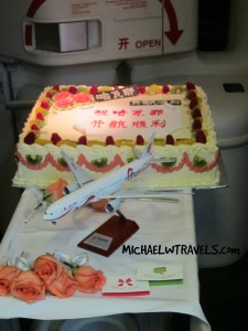 a cake with a model of an airplane on it