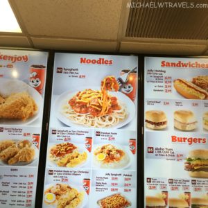 a menu board with pictures of food