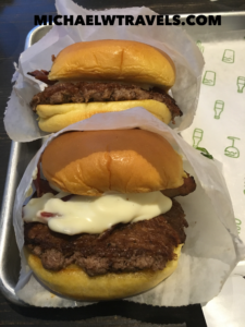 a two hamburgers on a tray