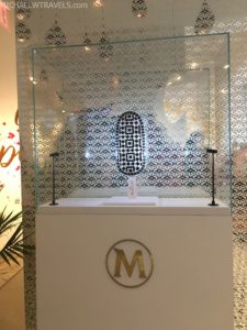 a glass display case with a letter on it