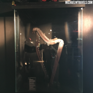 a harp in a glass case