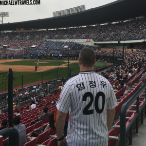 a man in a baseball uniform in a stadium