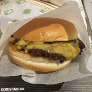 a cheeseburger on a paper wrapper