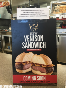 a sign with a sandwich on it