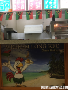 a sign with a picture of a chicken and flags