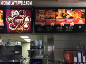 a menu board in a fast food restaurant