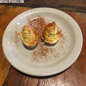 devil deviled eggs on a plate