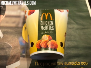 a yellow and green container with a picture of chicken
