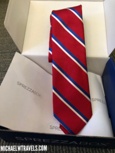 a red and blue tie in a box