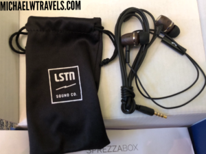 a black bag with earbuds and a black bag