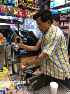 a man working at a coffee machine