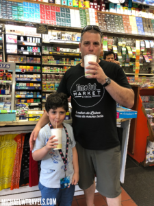 a man and boy standing in a store
