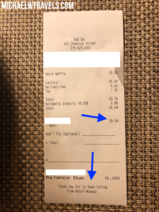a receipt with blue arrows and black lines