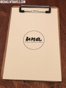 a clipboard with a logo on it