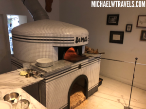 a brick oven with a wood burning stove