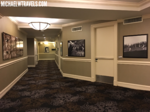 a hallway with pictures on the wall