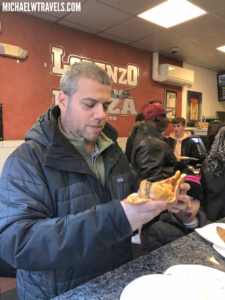 a man eating a pizza